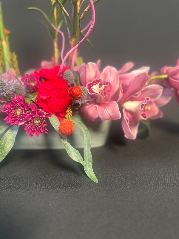 Stunning floral art in a black container,mums favorite!