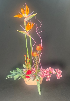 Stunning floral art in a black container,mums favorite!