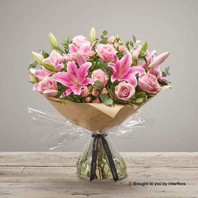 Pink Lily Pink Rose Pink Spray Rose & Greenery in a hand tied bouquet