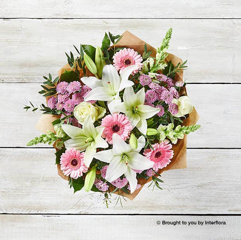 Pink Germini White Lily White Antirrhinum Pink Chrysanthemum Ivory Rose & greenery in hand tied bouquet