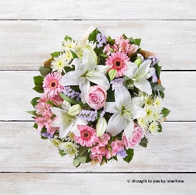 Pink Alstromeria White Lily Pale Pink rose White Chrysanthemum Lilac Statice Pink Germini & greenery in a Hand Tied Bouquet