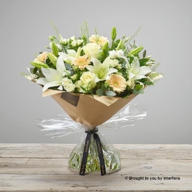 White Lisianthus White Spray Rose White Lily Ivory Rose Cream Germini & greenery in a hand tied bouquet