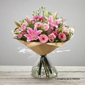 Pink Germini Pink Waxflower Pink Lily Pink Lisianthus Pink Rose & greenery in a hand tied bouquet