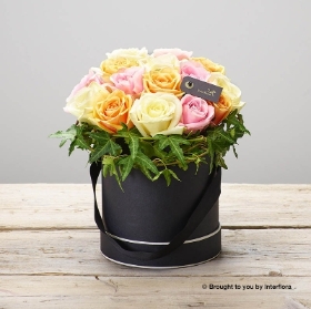 Ivory Pink and Peach Large head rose arranged in tall black & Cream round hatbox