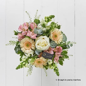 Pink alstro White antirrhinum Cream Germini Ivory rose & Greenery arranged in soft cream zinc jug