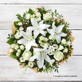 White spray Rose White Waxflower White Lily White Lisianthus Ivory Rose  & Greenery in a hand tied bouquet