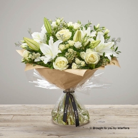 White spray Rose White Waxflower White Lily White Lisianthus Ivory Rose  & Greenery in a hand tied bouquet