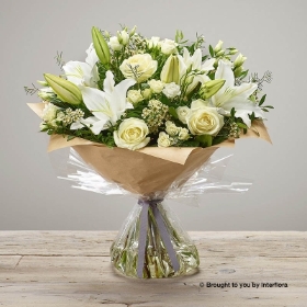 White spray Rose White Waxflower White Lily White Lisianthus Ivory Rose  & Greenery in a hand tied bouquet